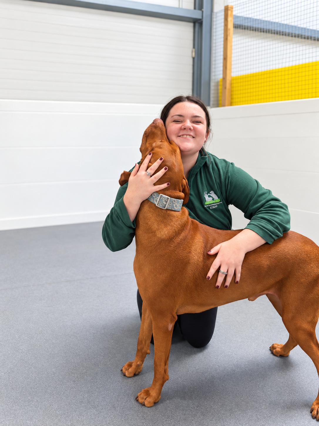 Emma Connolly with a dog at Creedons Dog Care