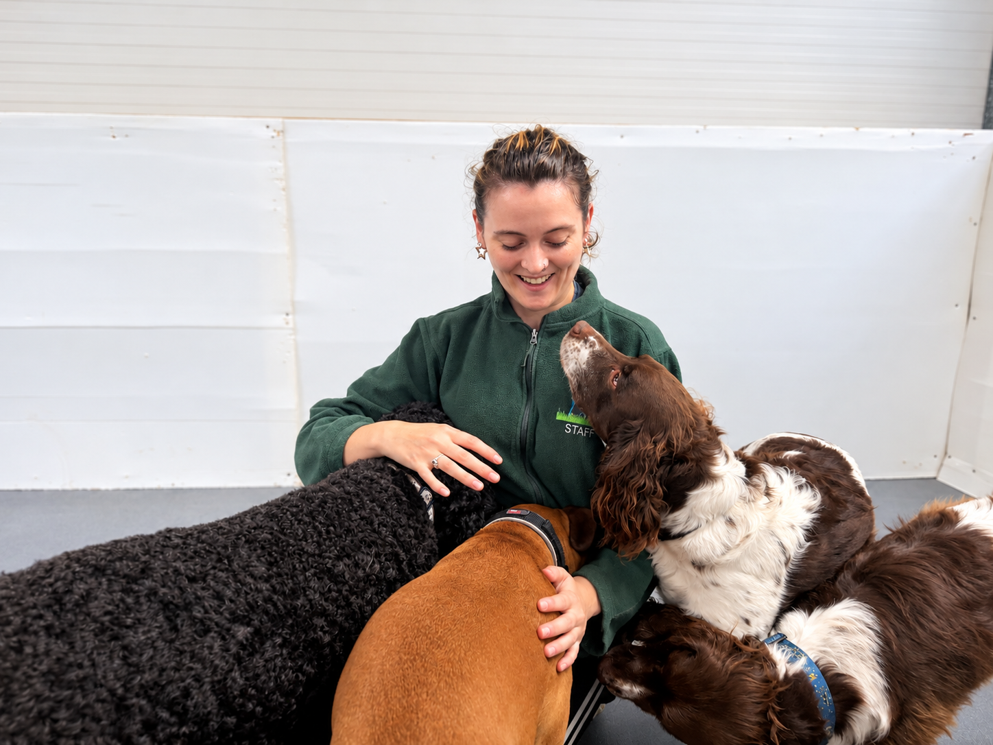 Rosie Kenneally with a dog at Creedons Dog Care